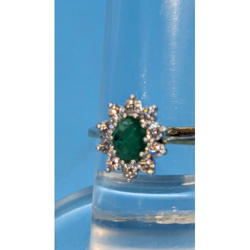 784 - Certificated 18ct yellow and white gold oval emerald and diamond cluster ring.  Emerald 0.80ct.  Dia... 