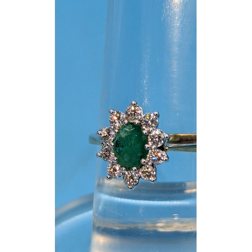 784 - Certificated 18ct yellow and white gold oval emerald and diamond cluster ring.  Emerald 0.80ct.  Dia... 