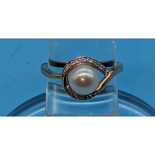 756 - 9ct yellow gold cultured pearl and half moon diamond ring.  Diamonds 0.05ct.
Ring Size N/O