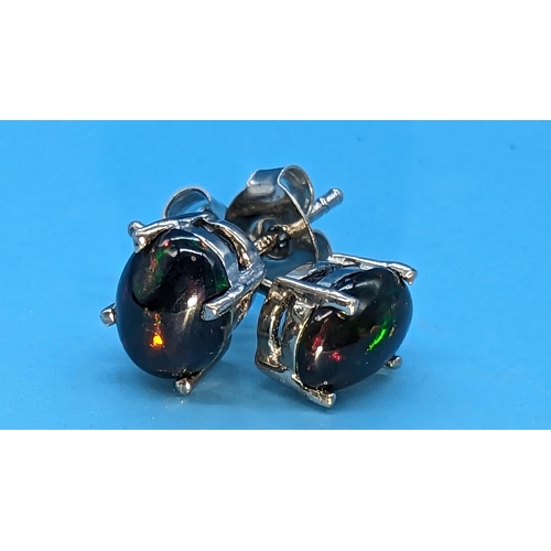 792 - Pair of Cabochon Ethiopian black opal studs in silver