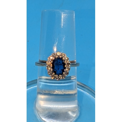 783 - 18ct rose gold oval kyanite and cluster ring.  Kyanite 1.27ct.  Diamonds 0.51ct.  Original WGI Cert.... 