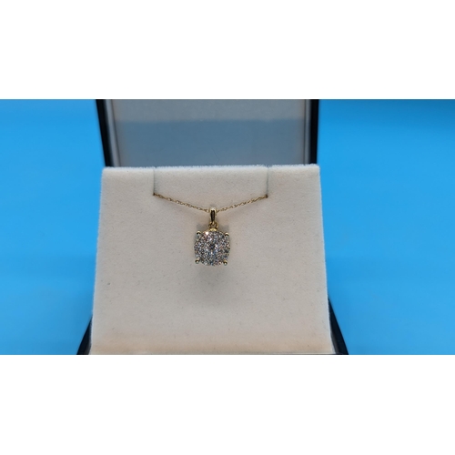 760 - 9ct yellow gold multi cluster diamond pendant on 9ct yellow gold chain. Diamonds 0.33ct. Boxed