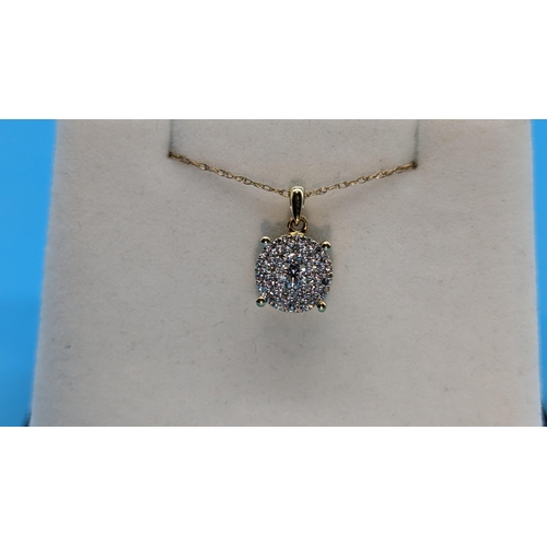 760 - 9ct yellow gold multi cluster diamond pendant on 9ct yellow gold chain. Diamonds 0.33ct. Boxed