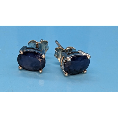 786 - Pair silver studs set with oval sapphire gemstone