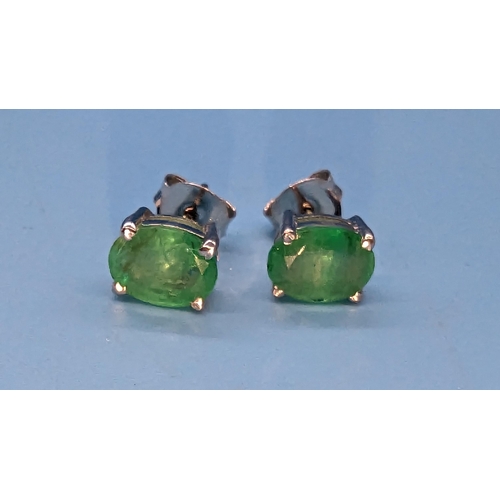 795 - Pair oval emerald studs in silver