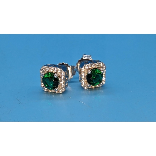 787 - Pair square shape cluster halo studs set with central green cubic zirconia surrounded by round white... 