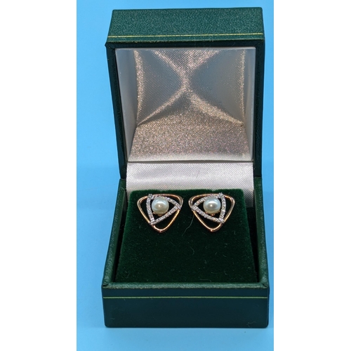 726 - Pair 9ct rose gold triangular shaped stud earrings set with pearls and diamonds.  Diamonds 0.20ct.  ... 