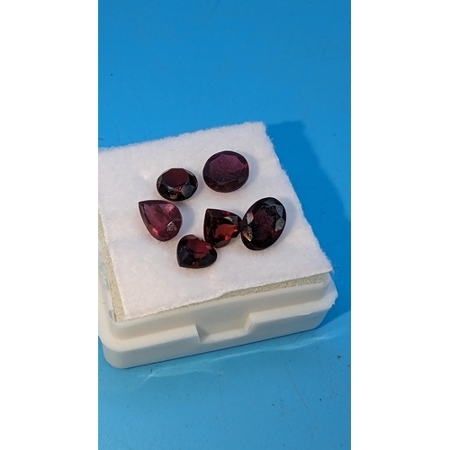 796 - A boxed parcel of 6 loose garnets, including heart, round, oval and pear shape.  4.90ct total