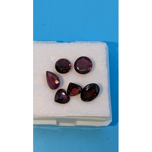 796 - A boxed parcel of 6 loose garnets, including heart, round, oval and pear shape.  4.90ct total