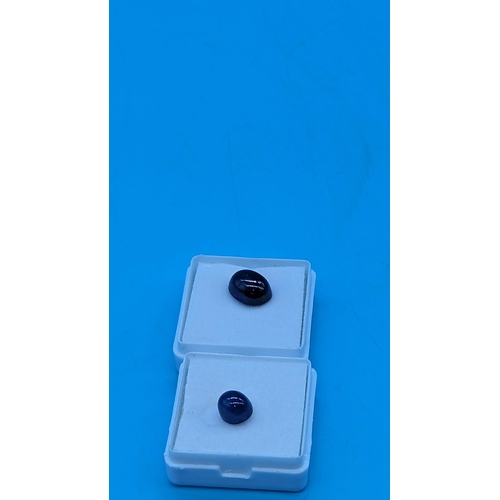 753 - 2 loose cabochon sapphires, [6.58ct / 3.65ct]. Boxed.