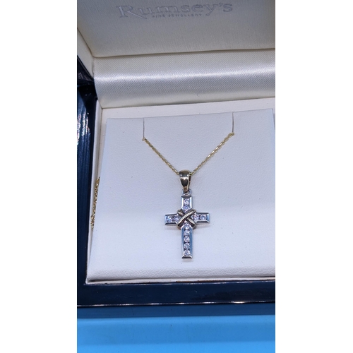 757 - 9ct yellow and white gold diamond  cross on a gold plated silver chain.  Boxed