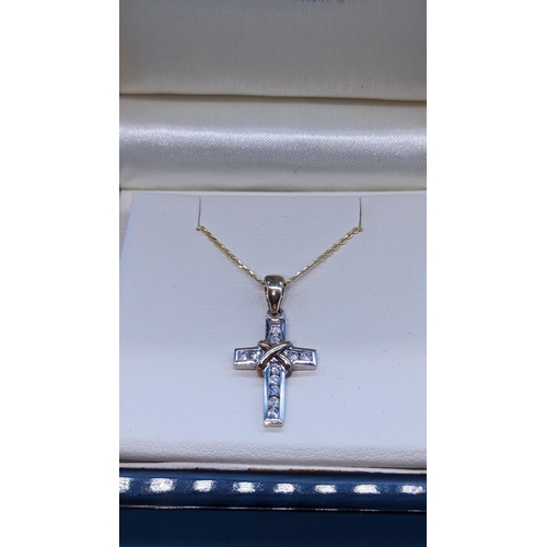 757 - 9ct yellow and white gold diamond  cross on a gold plated silver chain.  Boxed