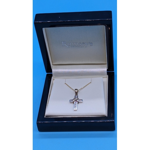 757 - 9ct yellow and white gold diamond  cross on a gold plated silver chain.  Boxed