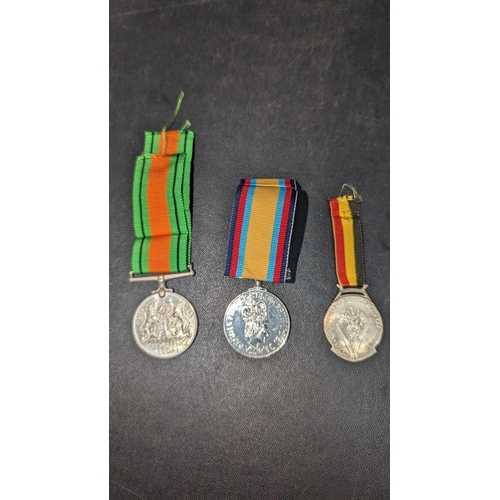 1505 - WWII Defence Medal, Gulf War Medal and another.