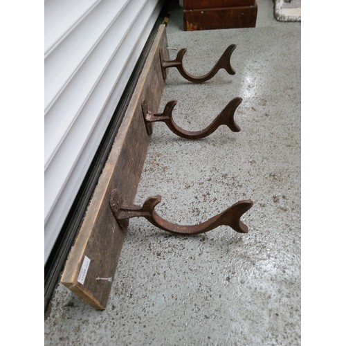 824B - 3 Antique Hooks on a Wooden Board