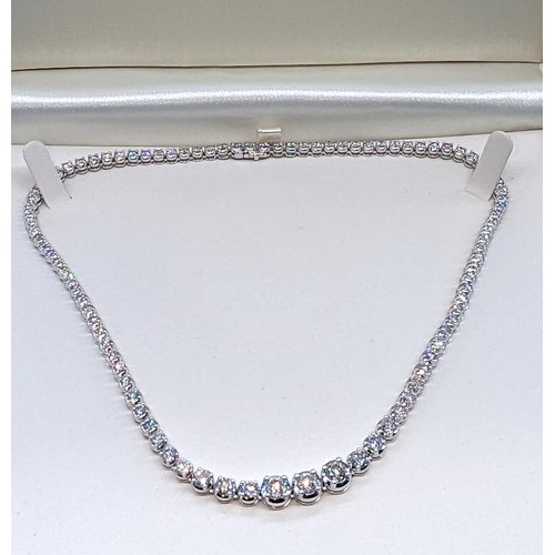 715 - 9ct white gold graduated round brilliant cut diamond line necklace.  Diamonds 12.00ct.  Boxed