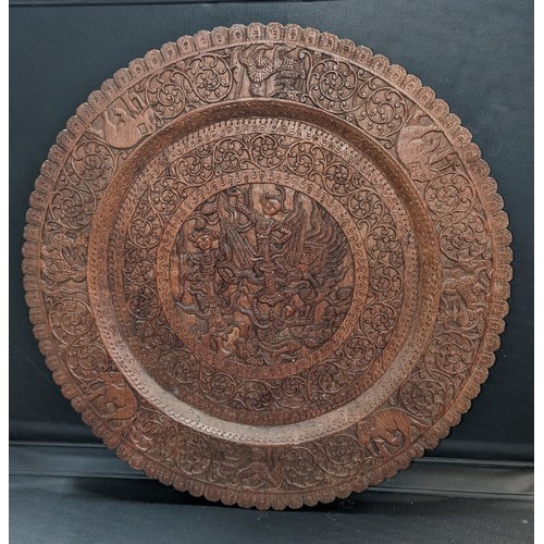 708 - A Large Hand Carved Burmese Wall Plate believed to have been brought back to the UK in 1855 after th... 