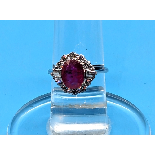 750 - 18ct White Gold Oval Ruby and Diamond Cluster Ring - Ruby 2.05ct, Diamonds 0.85ct
Ring Size O