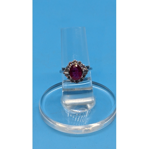 750 - 18ct White Gold Oval Ruby and Diamond Cluster Ring - Ruby 2.05ct, Diamonds 0.85ct
Ring Size O