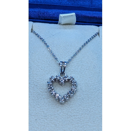 745 - 18ct White Gold Diamond Set Heart Pendant on a Silver Chain - Boxed