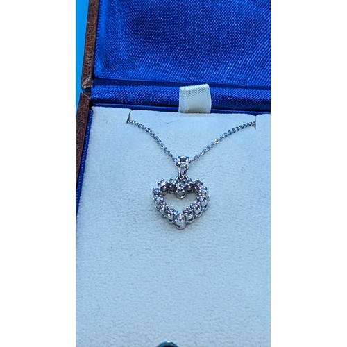 745 - 18ct White Gold Diamond Set Heart Pendant on a Silver Chain - Boxed