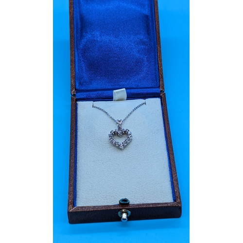 745 - 18ct White Gold Diamond Set Heart Pendant on a Silver Chain - Boxed