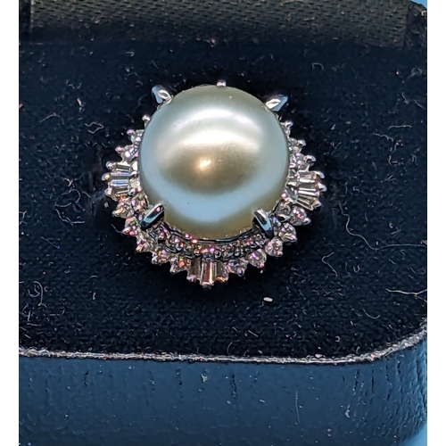 744 - Platinum Ring with a White Freshwater Cultured Pearl Surrounded by Two Halos of Round Brilliant Cut ... 