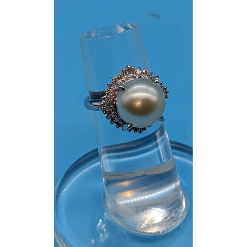 744 - Platinum Ring with a White Freshwater Cultured Pearl Surrounded by Two Halos of Round Brilliant Cut ... 