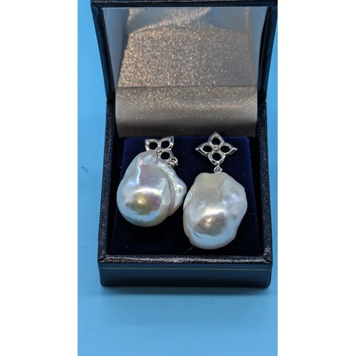 748 - Pair 18ct white gold white baroque pearl and diamond earrings.  Diamonds 0.02ct. Boxed