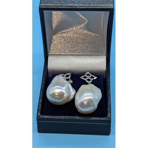 748 - Pair 18ct white gold white baroque pearl and diamond earrings.  Diamonds 0.02ct. Boxed