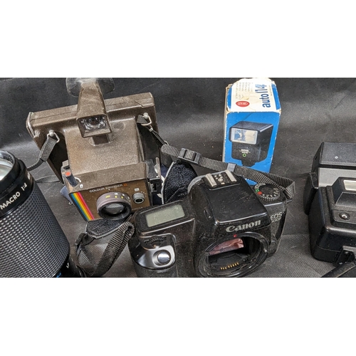 678B - An Assortment of Cameras, Flash Guns and Lenses