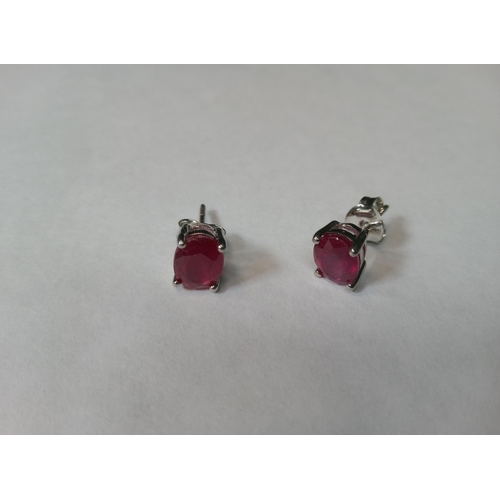 739 - A Pair of Ruby Studs Set in Silver