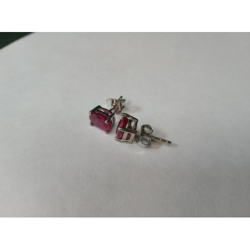 739 - A Pair of Ruby Studs Set in Silver