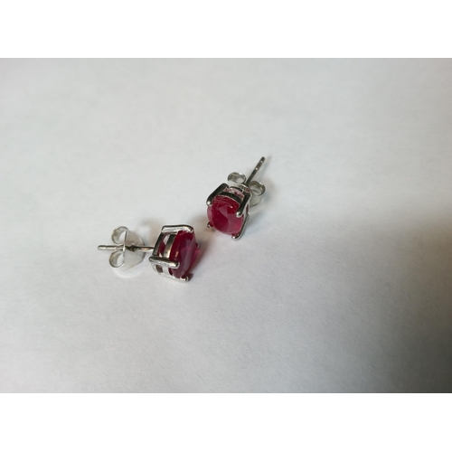 739 - A Pair of Ruby Studs Set in Silver