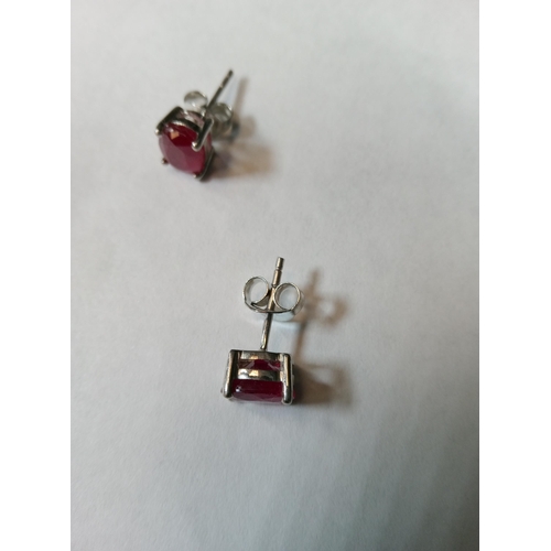 739 - A Pair of Ruby Studs Set in Silver