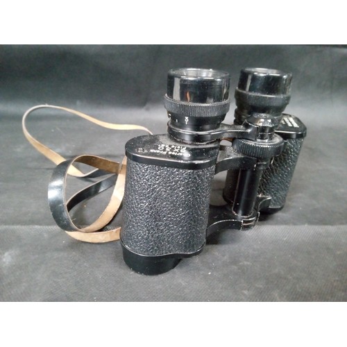 694 - A Pair of Charles Frank 8 x 30 Field 7.5 Binoculars.