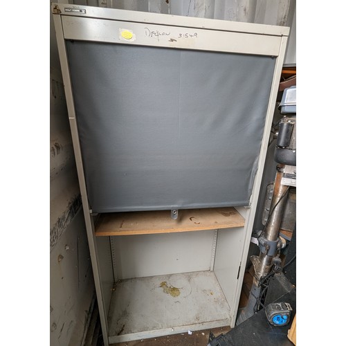 296 - A Metal Framed Storage Cabinet/ Stationary Cupboard with Roller Door