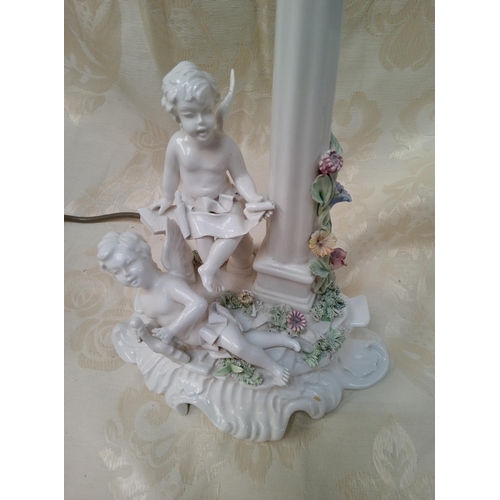 406 - A Lamp Base with Cherub Decoration.