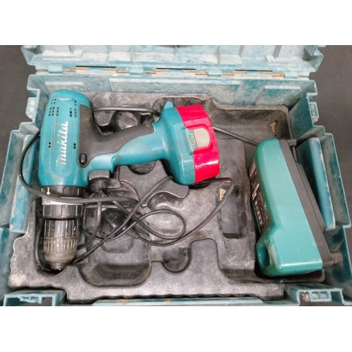 95 - A Makita 18 Volt Cordless Drill and Charger. Untested.