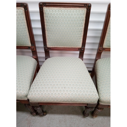 1243 - 3 Light Green Upholstered Dark Wood Chairs with Castors on front legs.