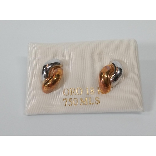 511B - A Pair of 18ct Gold Earrings. 1gm.