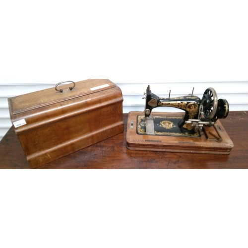 205 - Frister and Rossman Sewing Machine. Key missing but unlocked.