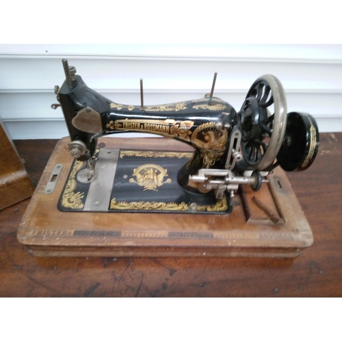 205 - Frister and Rossman Sewing Machine. Key missing but unlocked.