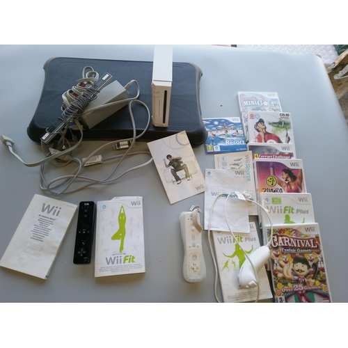 314 - Nintendo Wii with Leads, Games, Controllers, Instructions and Wii Fit Board.