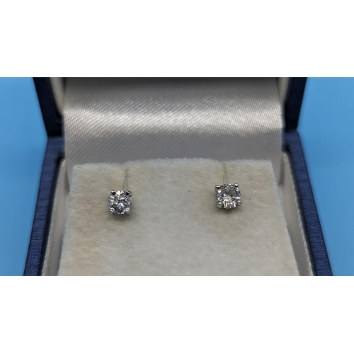 478 - A Pair of 18ct White Gold Round Brilliant Cut Diamond Studs approximately 0.40ct. Boxed.