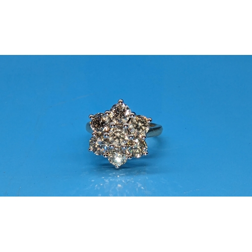 450 - 18ct white and yellow gold 7 stone daisy style round brilliant cut diamond cluster ring.  Diamonds 2... 