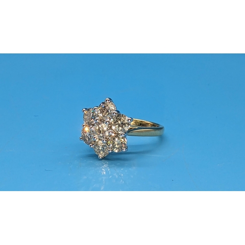 450 - 18ct white and yellow gold 7 stone daisy style round brilliant cut diamond cluster ring.  Diamonds 2... 