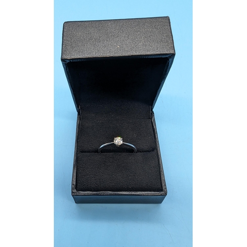 476 - 9ct white gold four claw solitaire diamond ring.  Diamond 0.25ct.  Boxed