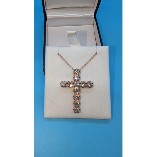 483 - 9ct rose gold cross set with round brilliant cut diamonds on a 9ct rose gold chain.  Diamonds 3.36ct... 