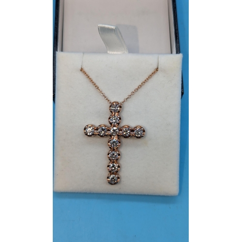 483 - 9ct rose gold cross set with round brilliant cut diamonds on a 9ct rose gold chain.  Diamonds 3.36ct... 